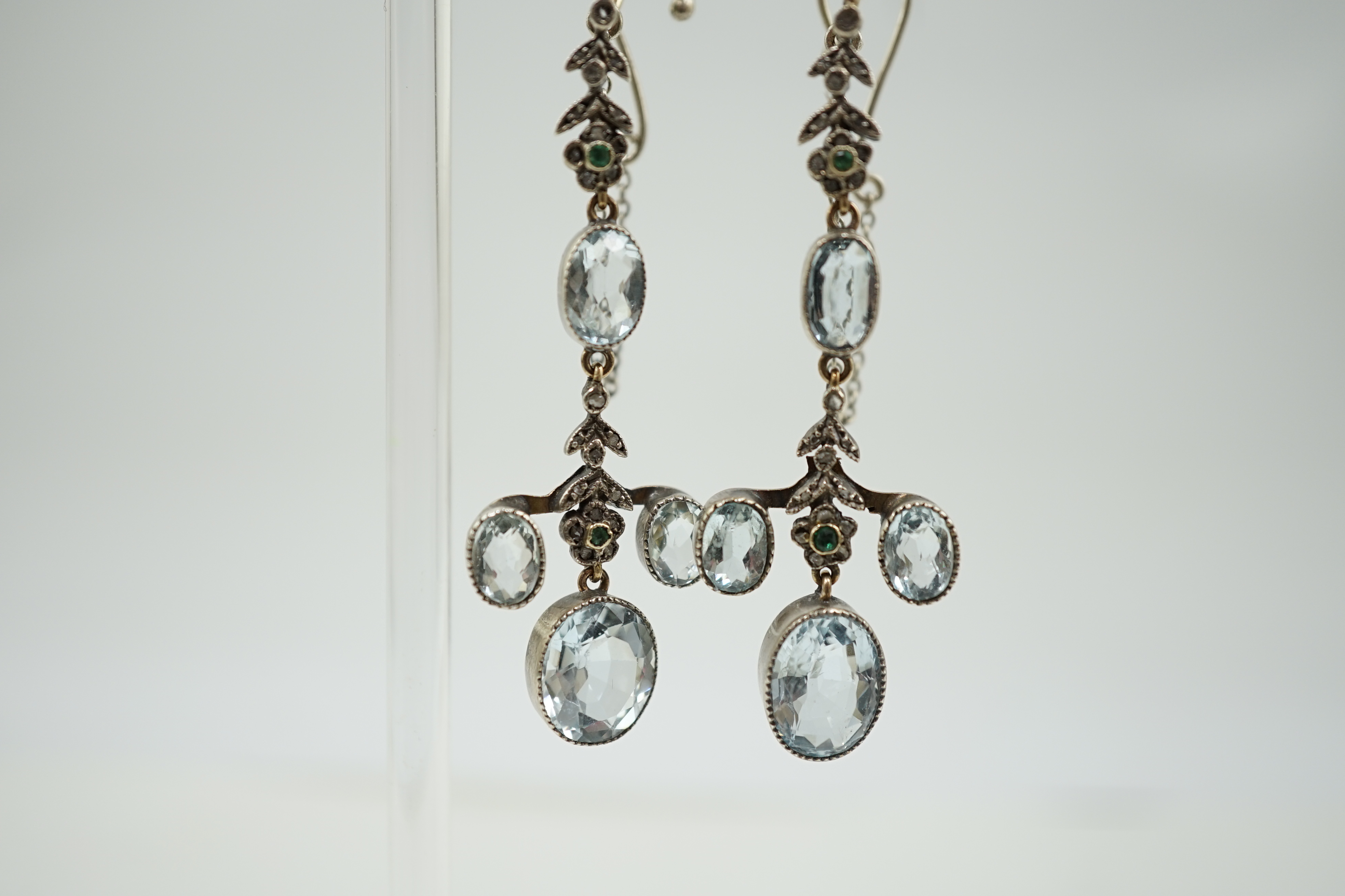 A pair of Belle Epoque gold and silver, aquamarine, rose cut diamond and emerald cluster set drop ear clips